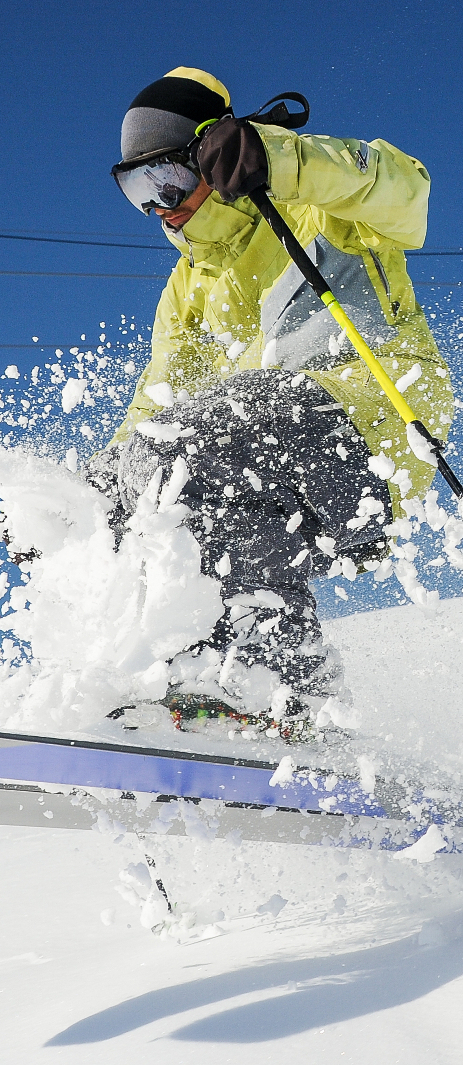 professional-skier-yellow-sportswear-riding-down-slope-georgia-gudauri tight